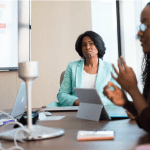 black women in a meeting
